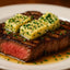 Grilled steak with herb butter featuring Bleu dAuvergne French blue cheese flavor