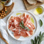 Prosciutto on a plate showcasing La Quercia Boneless Acorn Prosciutto made from acorn-fed pork