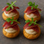Savory cream puff appetizers featuring Alexian Sliced Black Pepper Mousse 5oz, a pepper mousse 5oz product