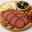Wooden charcuterie board with Busseto Salami Variety Pack Sliced for authentic Italian charcuterie boards