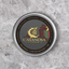 A sleek silver metal tin of casanova caviar with a dark gray lid featuring gold lettering and an ornate crest design