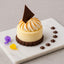Elegant dessert with chocolate garnish showcasing Rustic Bakery’s cocoa nib bar cookies
