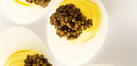 Egg extravaganza! Savor runny fresh eggs with caviar from The Caviar House. A delicious and traditional caviar combination.