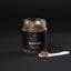 Jar of Imperia Truffle Sauce with black summer truffles and spoonful ready to serve