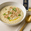 Creamy risotto garnished with white truffle oil and white truffles for gourmet flavor