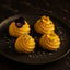 Gourmet potato rosettes with edible flowers drizzled in Imperia White Truffle Oil featuring white truffles