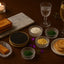 Kaluga Hybrid Reserve Caviar with accompaniments in a bulk party size tin, showcasing Huso Dauricus and Acipenser Shrenckii varieties