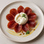 Prosciutto-wrapped burrata with pine nuts featuring Marcos Iberico Leg Bone In in bone-in presentation