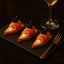Nova Style Salmon canapés with blackberries served as a gourmet appetizer