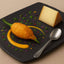 Artfully plated appetizer featuring Petit Basque Cheese from the French Pyrenees with traditional sheep milk