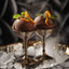 Two chocolate ice cream scoops in ornate silver cups with TCHO Dark and Bitter Chocolate Bar