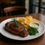 Grilled steak with chips and sauce featuring Torres Sea Salt Potato Chips and Mediterranean sea salt